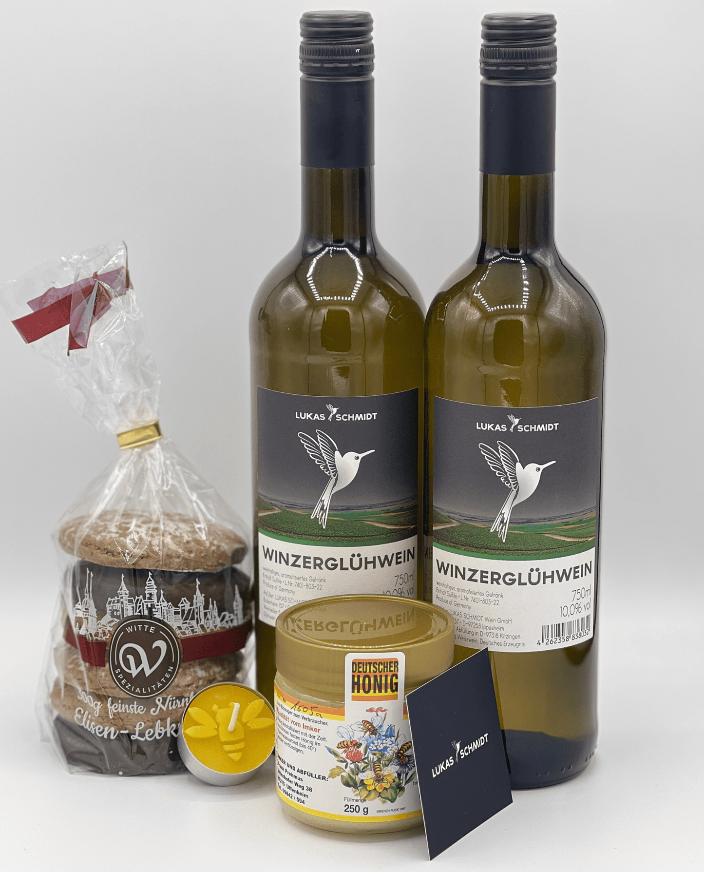 LUKAS SCHMIDT - Paket | "Winzerzauber" | 2 Flaschen Winzerglühwein, 1 Packung Witte Elisenlebkuchen, 1 Seenland Honig, 1 Kerze aus Bienenwachs - LUKAS SCHMIDT® Premium Weine